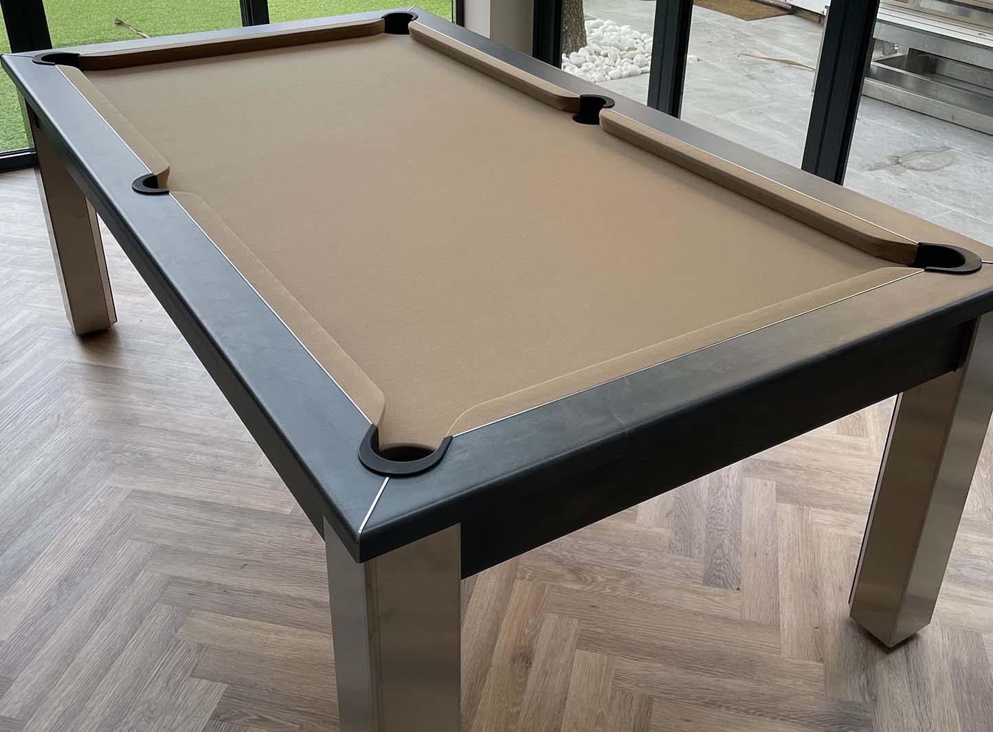 Light beige pool table cloth grey frame in a conservatory