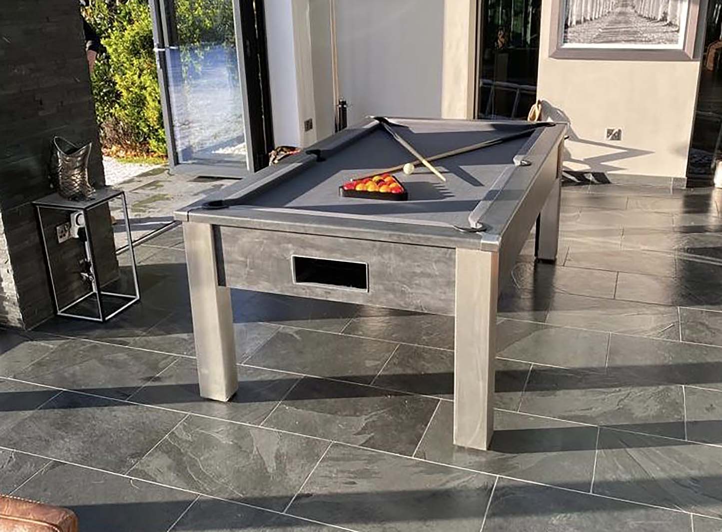 grey pool table in conservatory