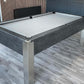 dark grey pool table with light grey cloth