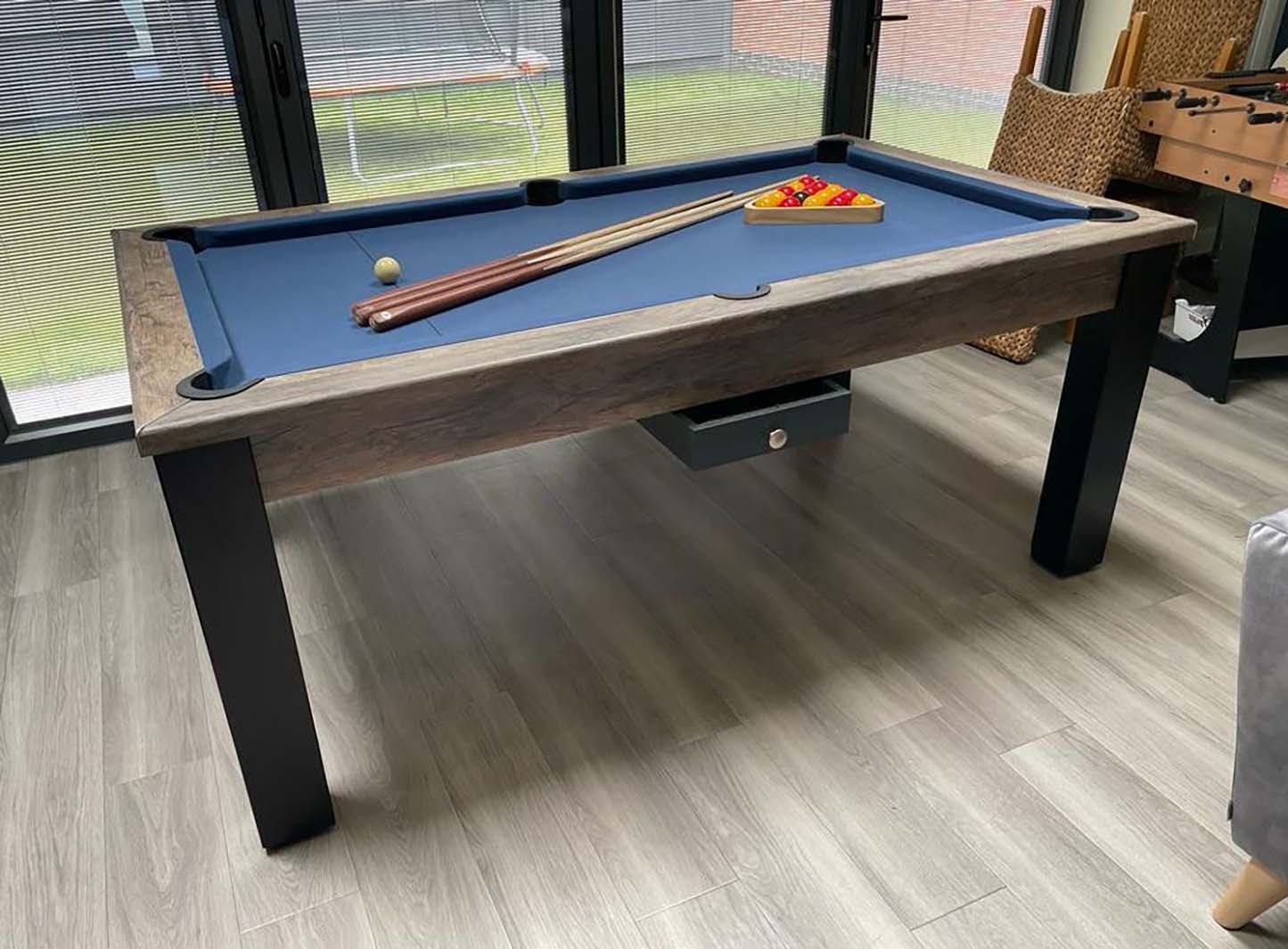 Pool table with blue felt cloth