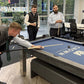 men playing pool on a table with logo printed onto cloth