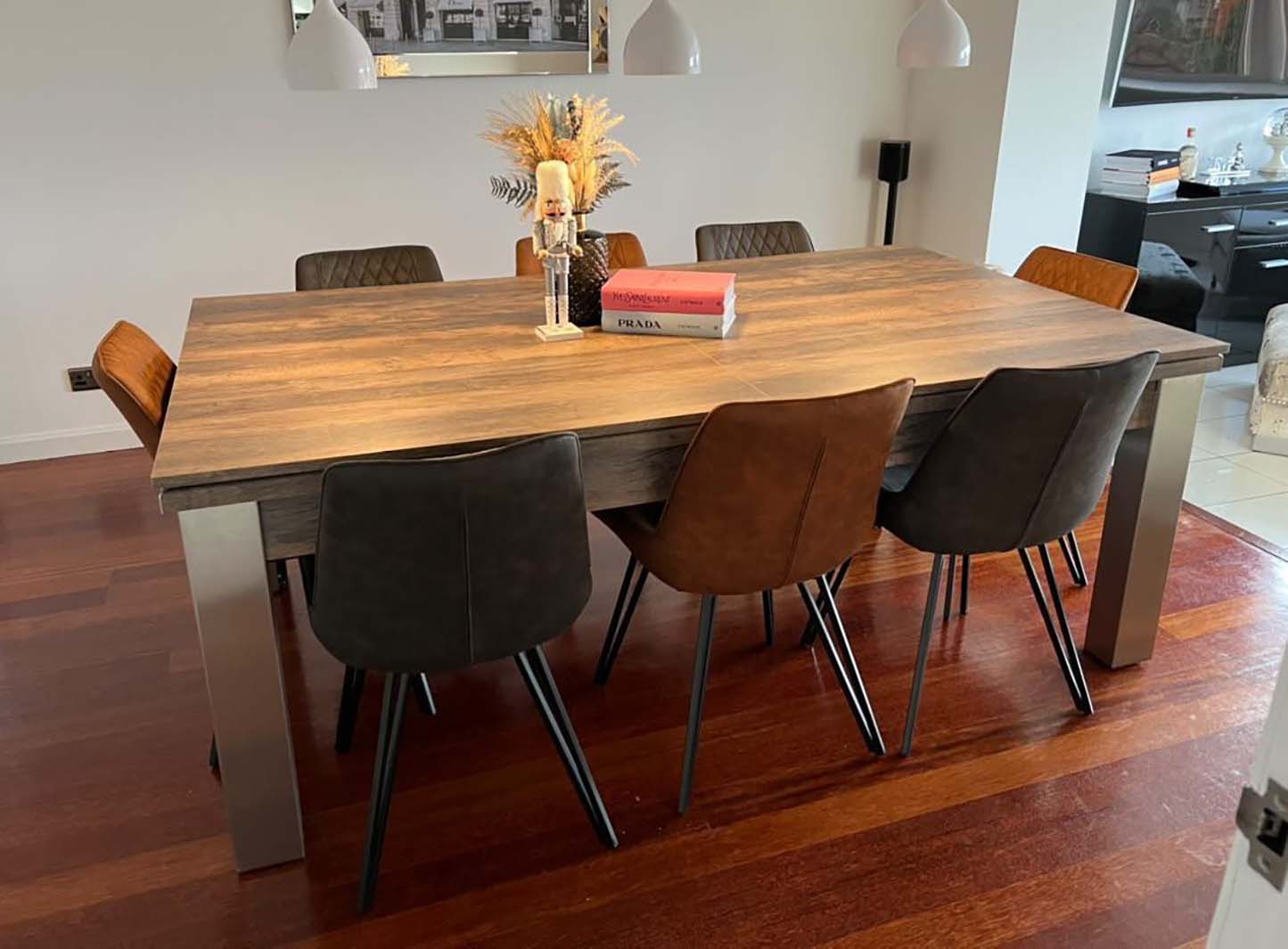 Dining table with chairs in dining room converts into pool table