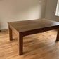 Dining table configuration in games room in farmhouse oak