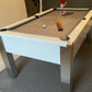 gloss white framed pool table with light grey cloth cues and balls