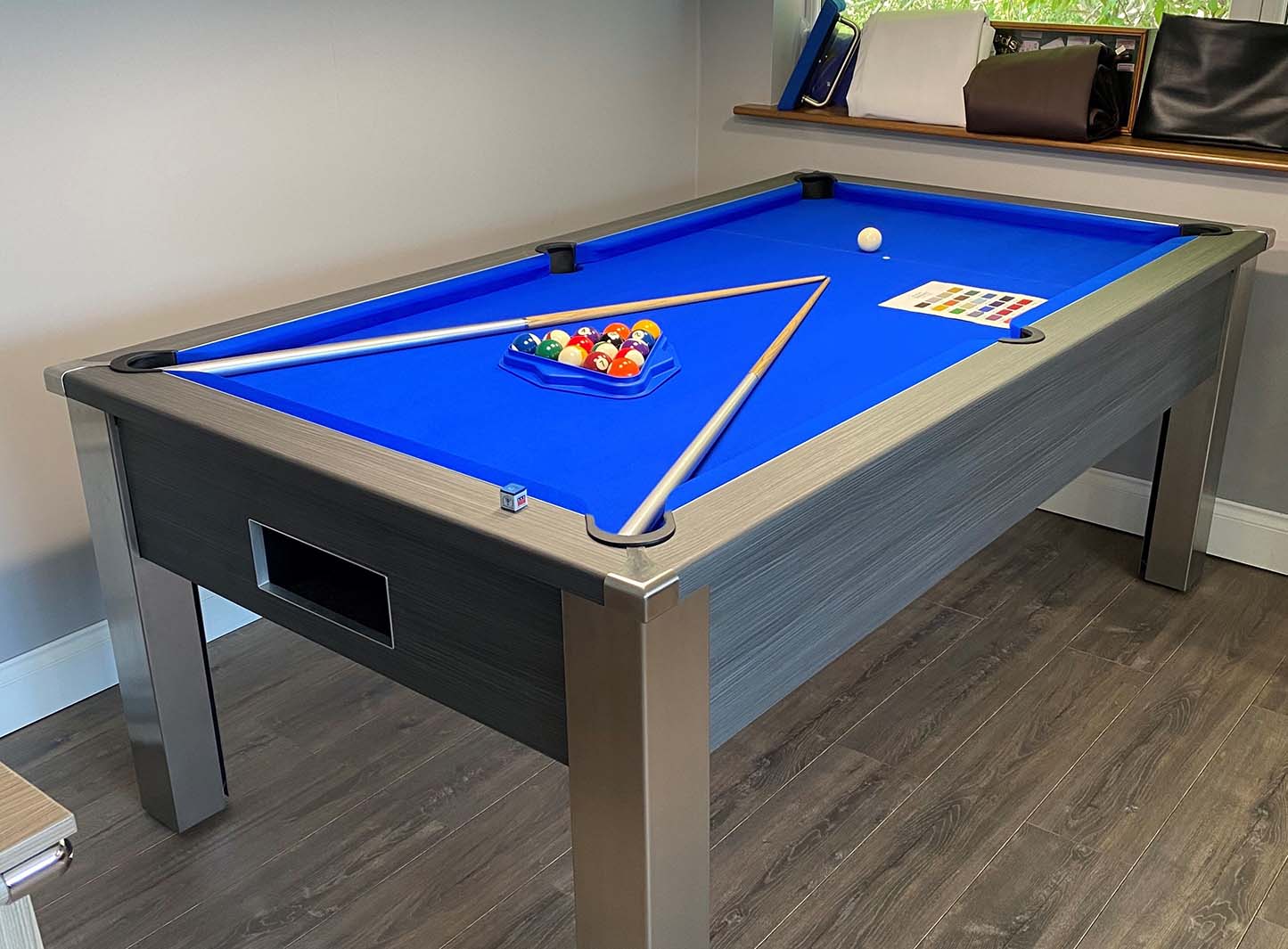 royal blue cloth on a grey pool table