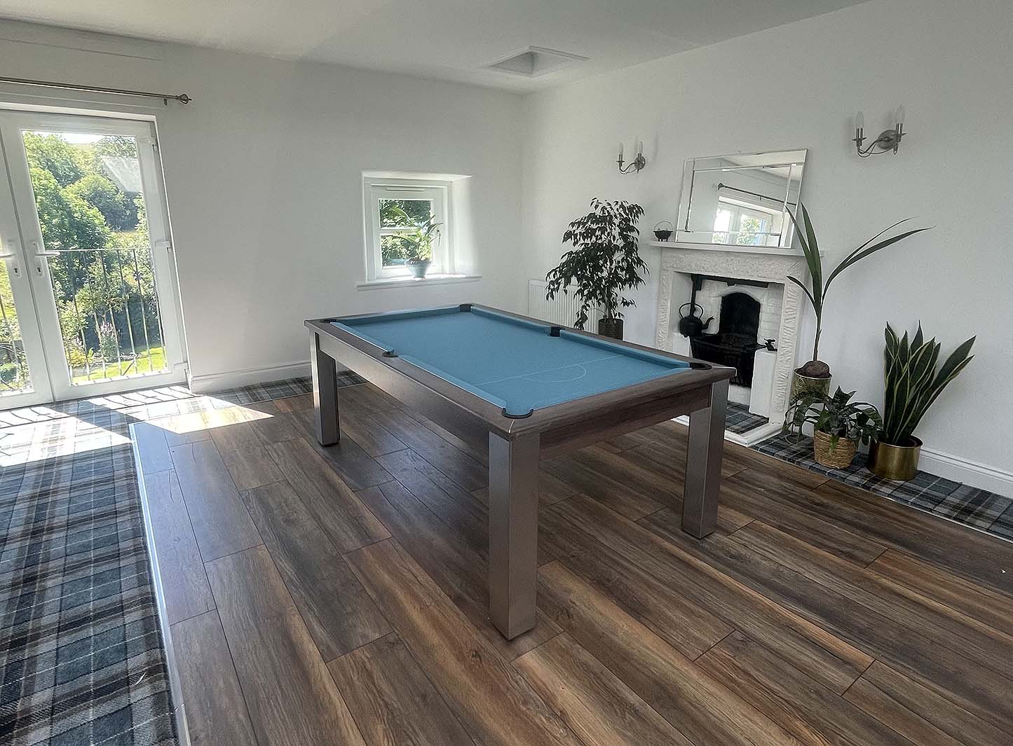 pool table dining table green cloth in a dining room