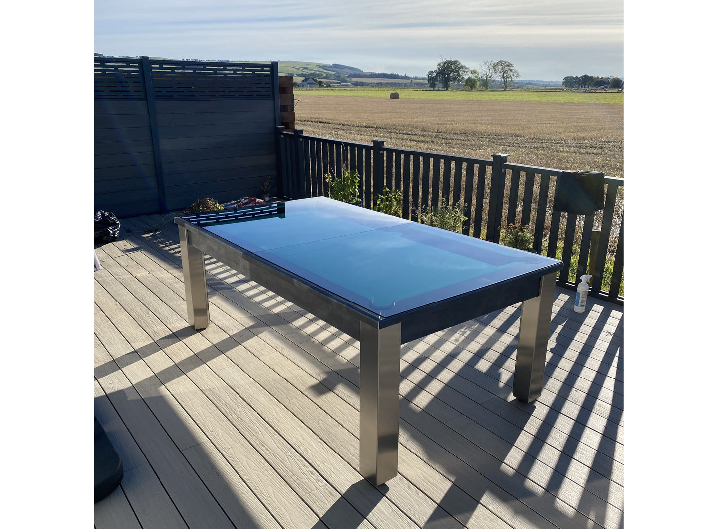 Glass cover on outdoor pool table