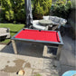 Red cloth outdoor pool table