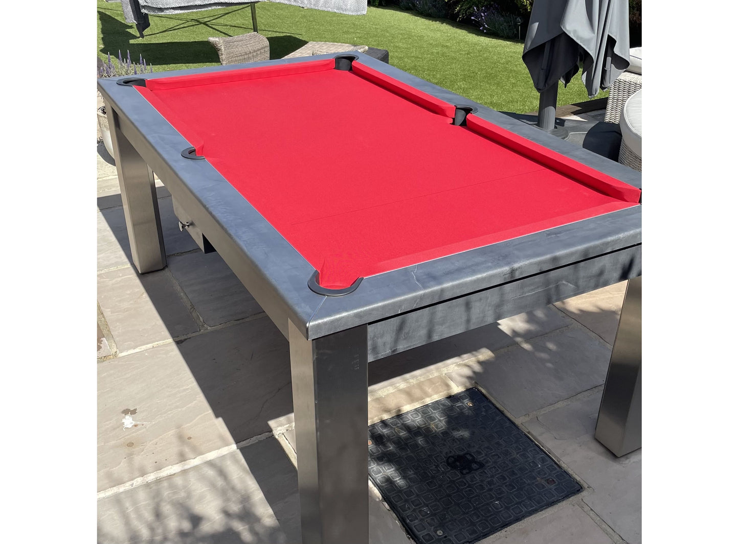 Red cloth outdoor pool table