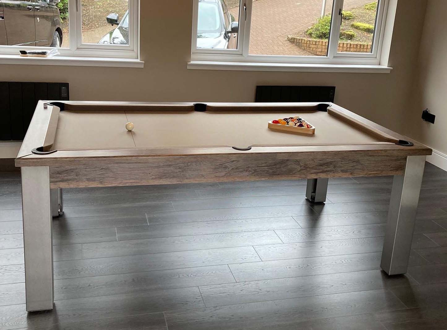 Light tan cloth pool table in a modern games room