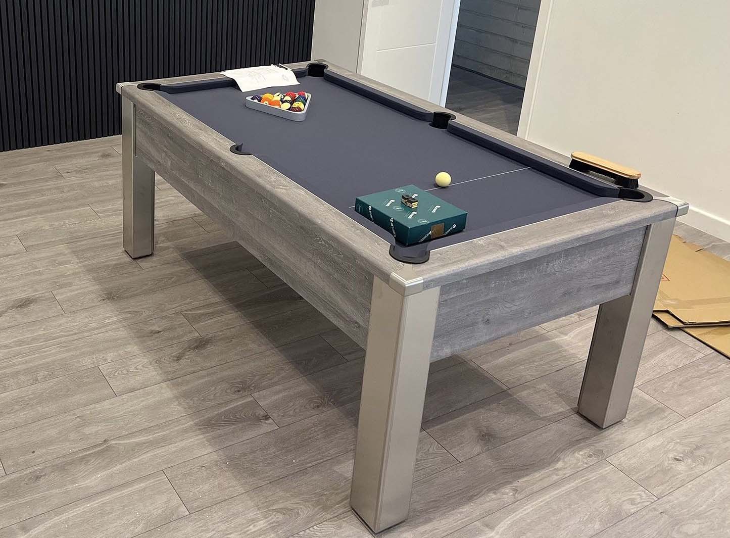 grey pool table installed and ready to play