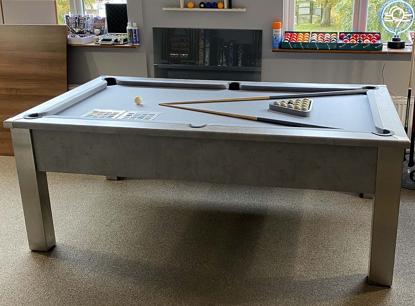 side view of a grey pool table