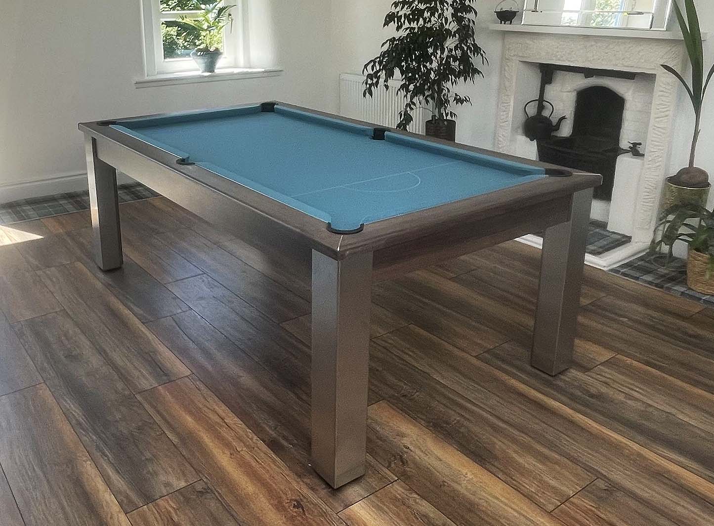 green cloth pool table in a dining room